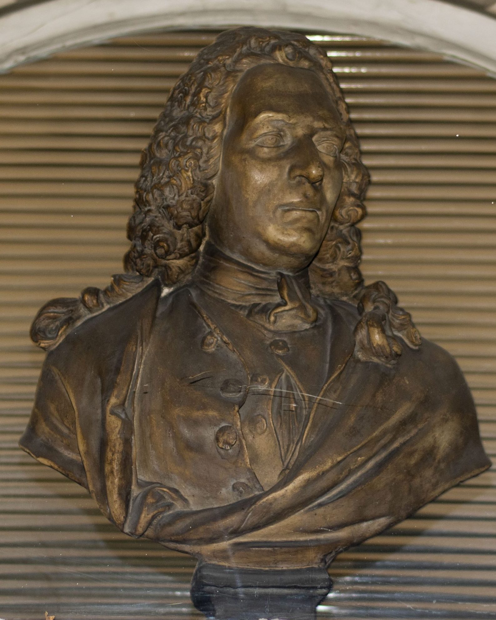 The terracotta / plaster bust of Bartholomew Mosse by Van Nost measures 70cm high and stands over the entrance to the front hall at the Rotunda Hospital.