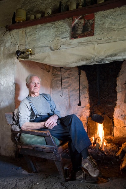 George Thomas by his open fire. Photo: James Fennell.
