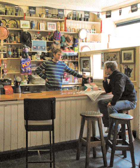 The tongue and groove counter and back bar runs down one side of the room, its stools occupied by men and women who know each other well. 