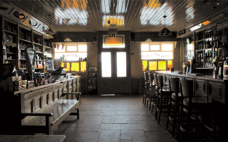 The grocery and bar sections run along opposing sides of the wall, separated by a flagstone floor salvaged from the pavement of Dublin’s Mountjoy Square. The counter tops were salvaged from an abandoned ship in Belfast Harbour. Photo: James Fennell.